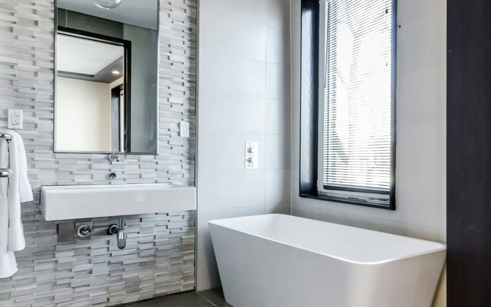 Auckland bathroom with an opening window that helps remove moisture at source through good bathroom ventilation Auckland bathroom with an opening window that helps remove moisture at source through good bathroom ventilation