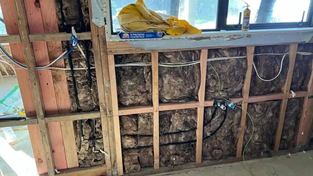 Carpenter framing timber walls on an Auckland job site, one of many carpenter services available locally