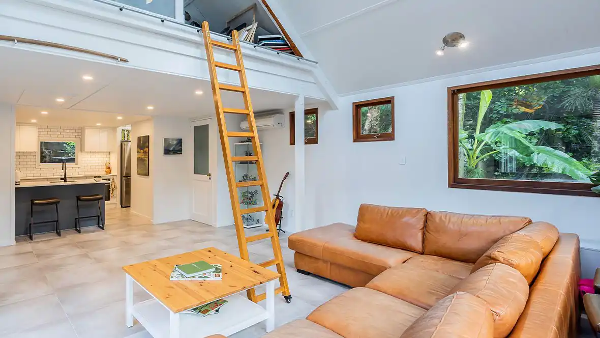Open-plan Auckland living and kitchen space used to test sightlines and flow during kitchen layout planning Open-plan Auckland living and kitchen space used to test sightlines and flow during kitchen layout planning