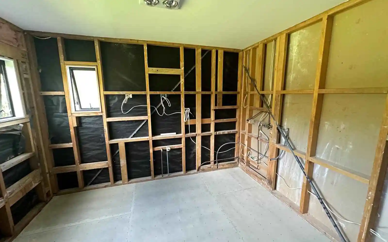 Renovation site set up with framing exposed, protected access and separation from the occupied home Renovation site set up with framing exposed, protected access and separation from the occupied home