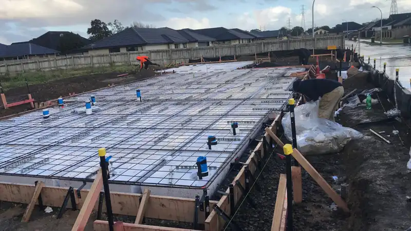 Concrete foundation poured for a small Auckland build, part of what drives tiny home build costs Concrete foundation poured for a small Auckland build, part of what drives tiny home build costs