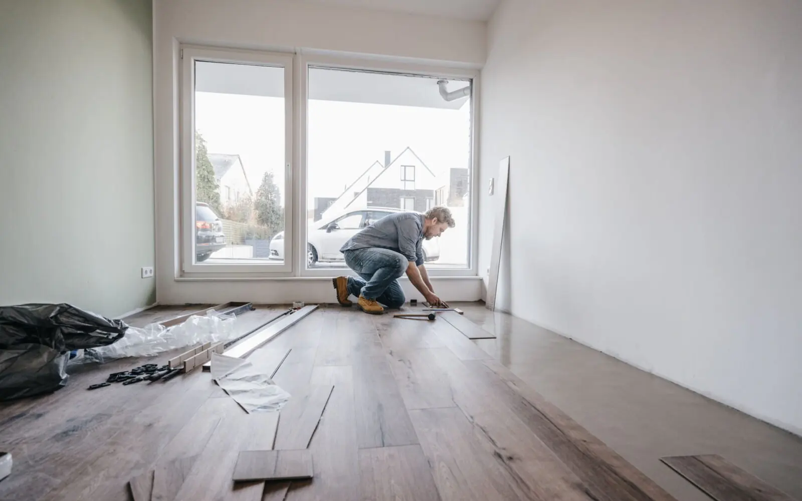 New flooring laid in an Auckland home, showing the comfort gained by renovating rather than moving