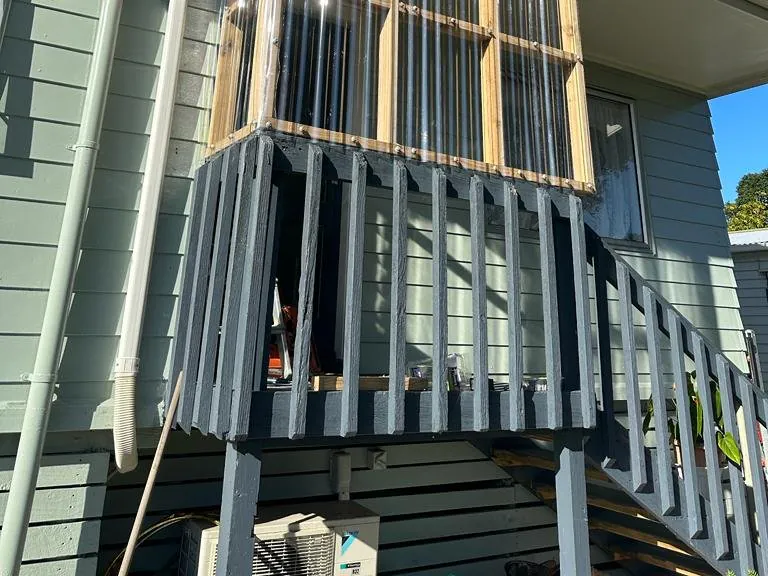 Carpenter finishing interior trim work on an Auckland renovation