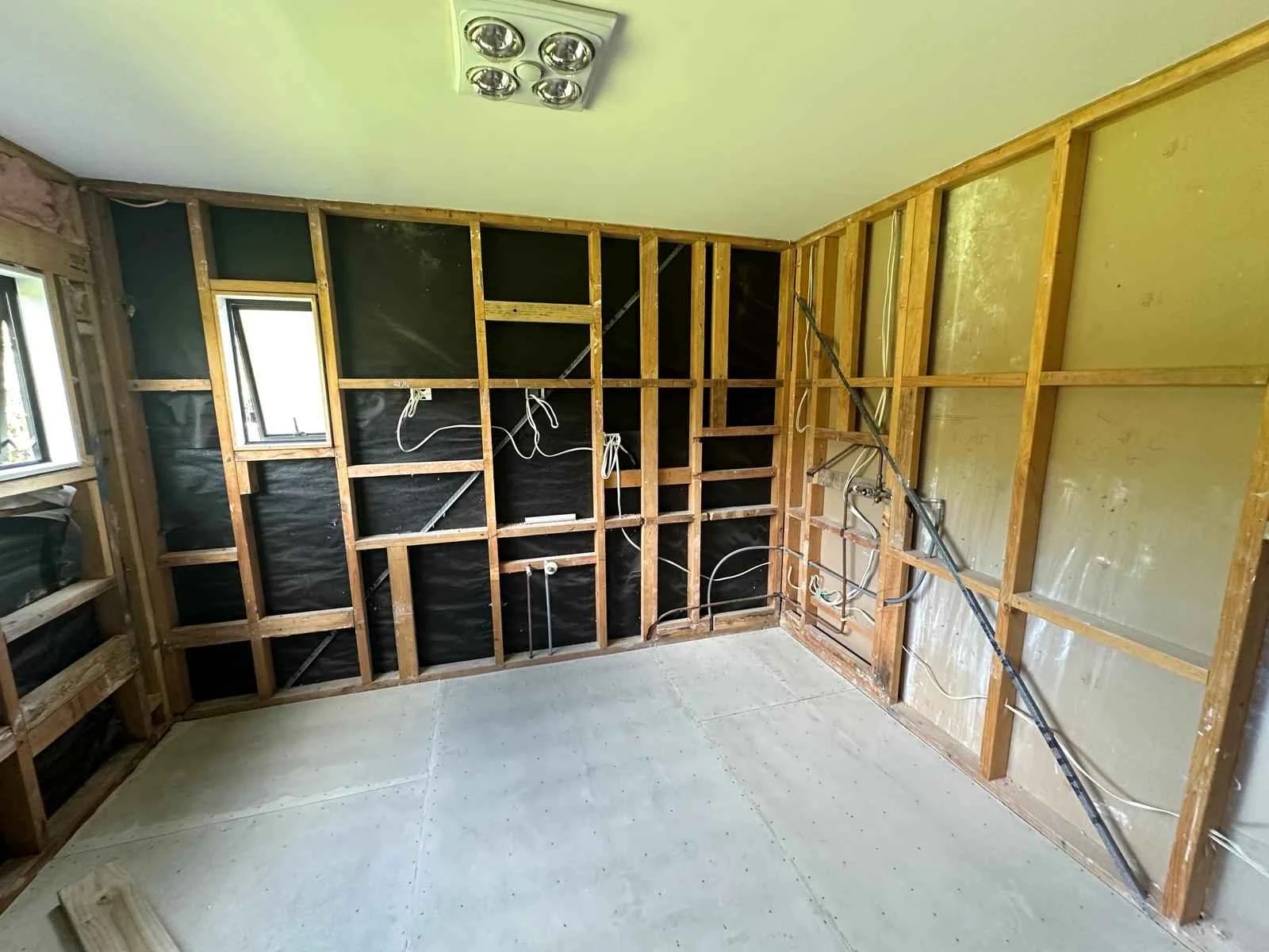Room stripped back to framing and insulation during an Auckland home renovation